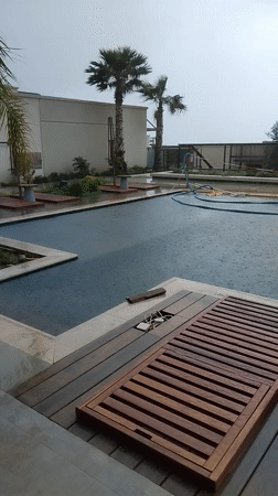 Rainstorm hits swimming pool area in Irakleides, Greece
