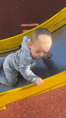 Mother and child enjoy afternoon playground visit in Chelyabinsk