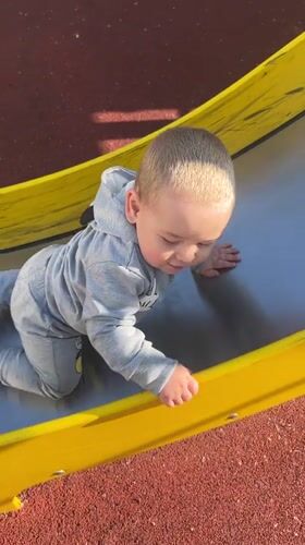 Mother and child enjoy afternoon playground visit in Chelyabinsk