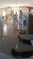 Religious ceremony with white-robed participants observed in Lokoja, Nigeria