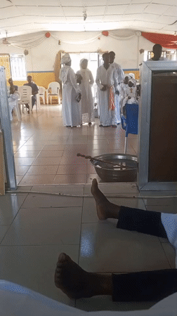 Religious ceremony with white-robed participants observed in Lokoja, Nigeria