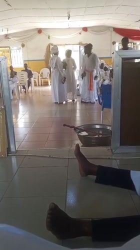 Religious ceremony with white-robed participants observed in Lokoja, Nigeria