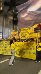 Strike protest marches through São Paulo streets at night