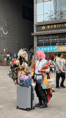 Cosplayers with luggage spotted in Qingyang District plaza