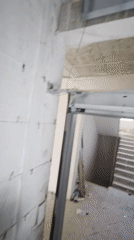 Inside an elevator shaft, control panel and mechanics up close