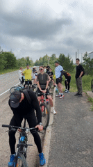 Cycling group makes roadside stop in Kharnavy, Russia