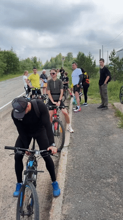 Cycling group makes roadside stop in Kharnavy, Russia