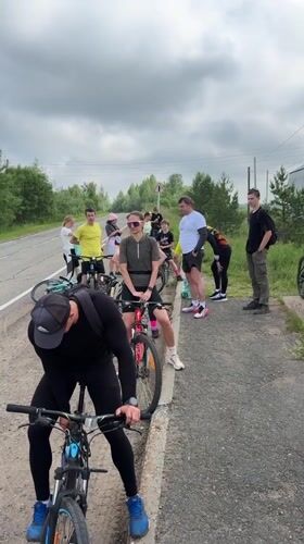 Cycling group makes roadside stop in Kharnavy, Russia
