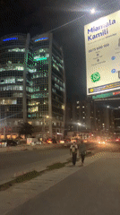 Modern curved building photographed during Dar es Salaam night scene