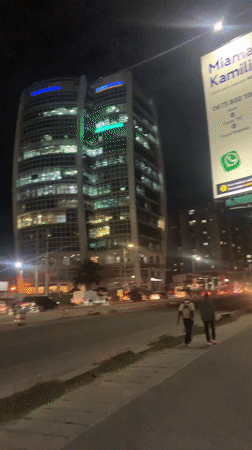 Modern curved building photographed during Dar es Salaam night scene