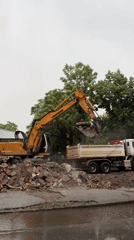 Excavator loads debris at construction site in Plovdiv