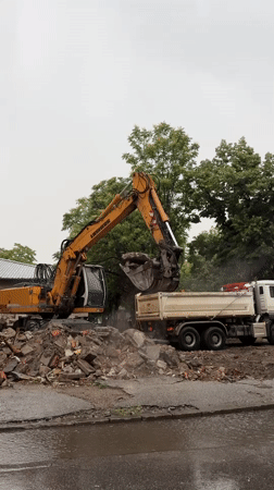 Excavator loads debris at construction site in Plovdiv
