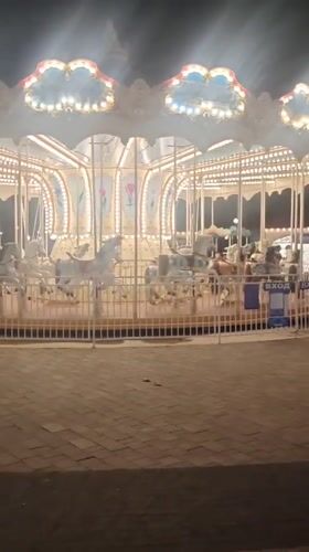 Night carousel spinning in Vinogradny, Russia