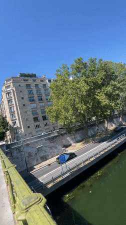 Seine riverfront views with the Eiffel Tower on a sunny afternoon