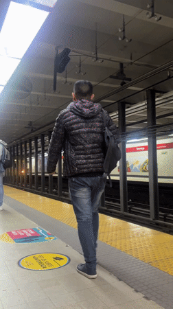 Evening commuters navigate Buenos Aires subway platform safety protocols