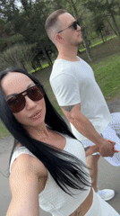 Spring visitors film selfies at wooded stream in Russia