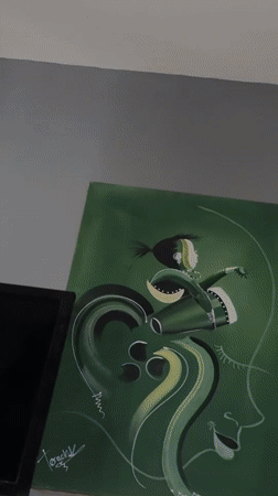 Resident documents home interior with artwork in Kurunduma, Nigeria