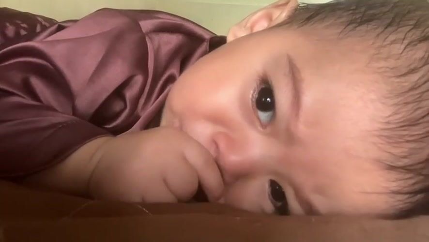 Family moments captured in Indonesian home with baby and child