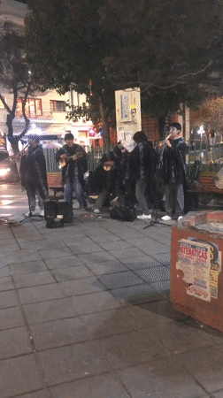 Young musicians busk with traditional instruments in La Paz plaza