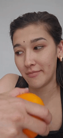 Ordinary moments captured in Tashkent: woman with orange, philosophical text