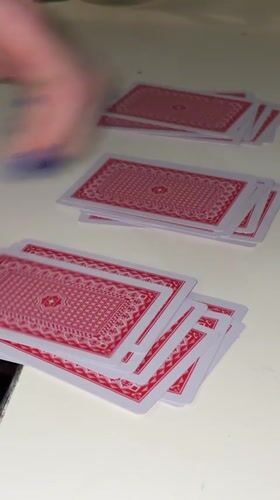 Woman plays solo card game in Kragujevac apartment
