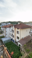 Sunset overlooking Zlatograd, Bulgaria neighborhood with red-tiled roofs