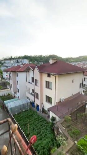 Sunset overlooking Zlatograd, Bulgaria neighborhood with red-tiled roofs