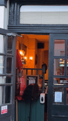 London pub entrance captured with no-smoking signage visible