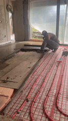Construction worker documents concrete pouring project in Krasnodar