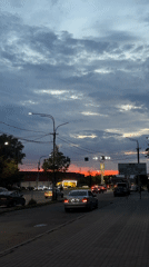 Dramatic sunset colors illuminate cloudy Yerevan sky at dusk