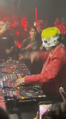 Masked DJ performs late-night set at packed Paris nightclub