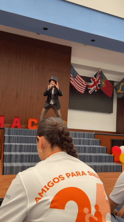 Steampunk performer entertains youth audience at Mexico gymnasium event