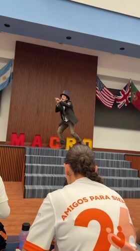 Steampunk performer entertains youth audience at Mexico gymnasium event