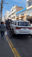 Vehicle towing incident with police presence on city street