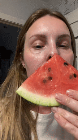 Family shares watermelon and wine in Noviy, Russia
