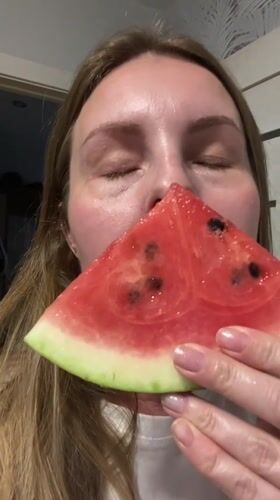 Family shares watermelon and wine in Noviy, Russia