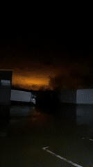 Nighttime footage captures wet parking area in Kazan