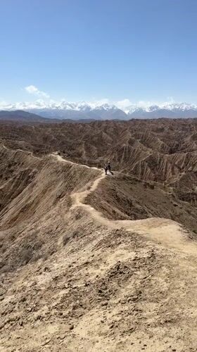 Hiker documents mountain trail journey near Lake Issyk-Kul, Kyrgyzstan