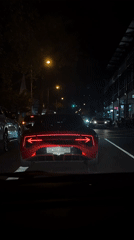 Red McLaren GT spotted in Cape Town evening traffic