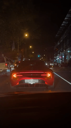 Red McLaren GT spotted in Cape Town evening traffic