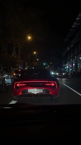 Red McLaren GT spotted in Cape Town evening traffic