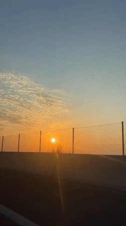 Sunset observed from moving vehicle in Massalfassar, Spain