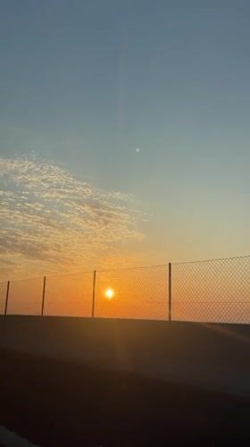 Sunset observed from moving vehicle in Massalfassar, Spain