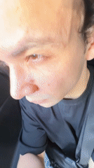 Driver squints from bright sunlight in Tashkent car