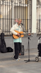 Street musician performs near Moscow Central Bank building