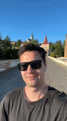 Tourist documents historic Lower Gate district in Stříbro, Czechia