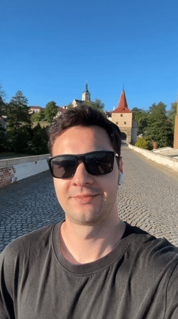 Tourist documents historic Lower Gate district in Stříbro, Czechia