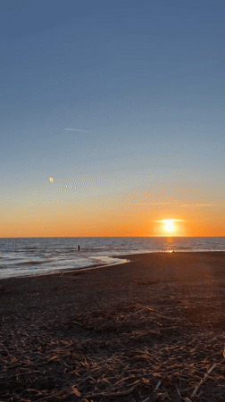 Sunset witnessed at Lido di Tarquinia beach, Italy