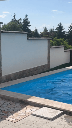 Boy enjoys afternoon swim session in Markovo pool