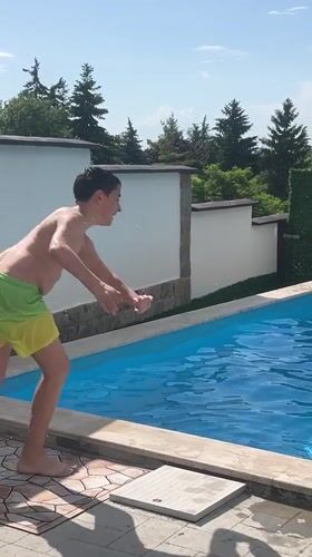 Boy enjoys afternoon swim session in Markovo pool